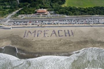 1100+ people create “Impeach!” on a CA Beach…
