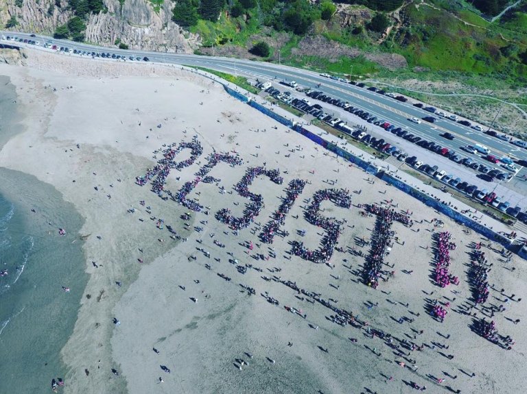 Thousands Gather On Beach, Send Message To Trump
