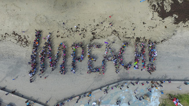 Anti-Trump Protestors Spell Out ‘IMPEACH’ on Ocean Beach
